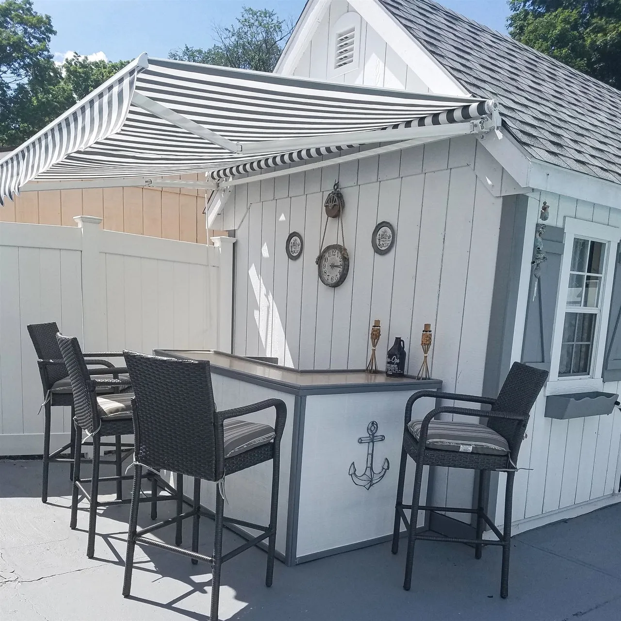 Aleko Retractable White Frame Patio Awning - 13 x 10 Feet - Gray and White Striped